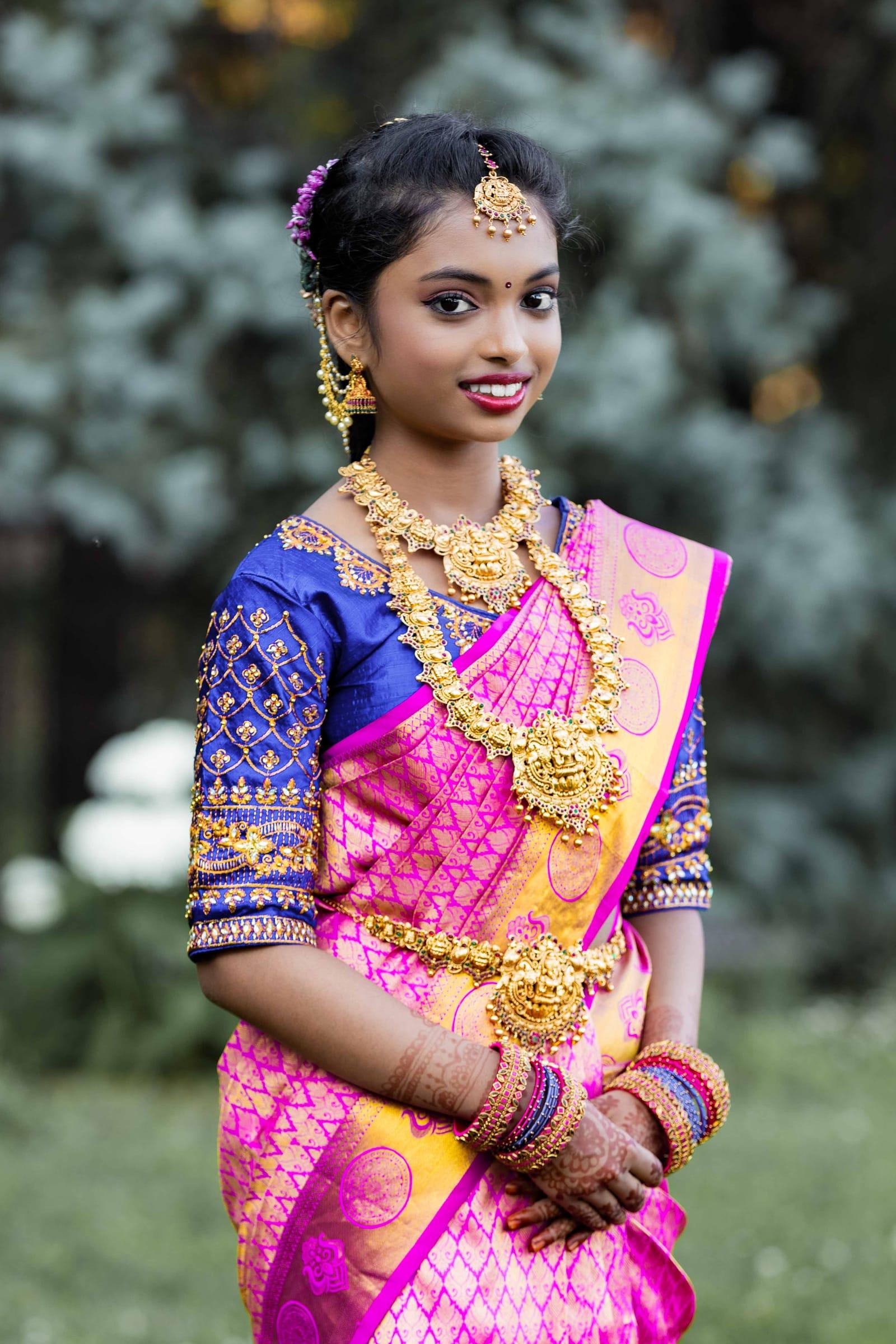 Teen in a pink silk half-saree, half-saree ceremony portrait