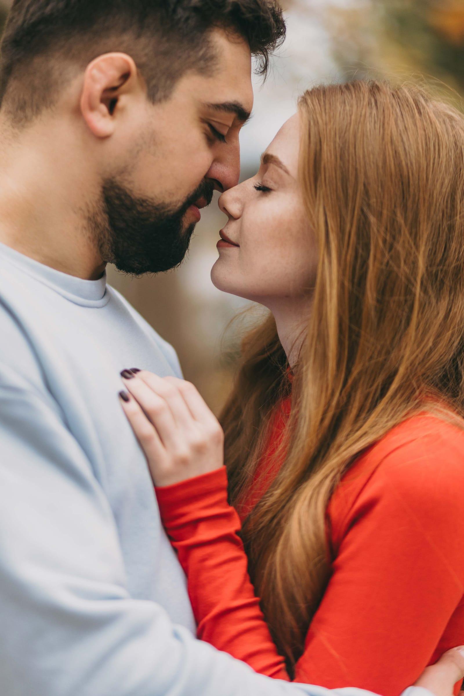 Couple touch noses in an intimate engagement session in Toronto