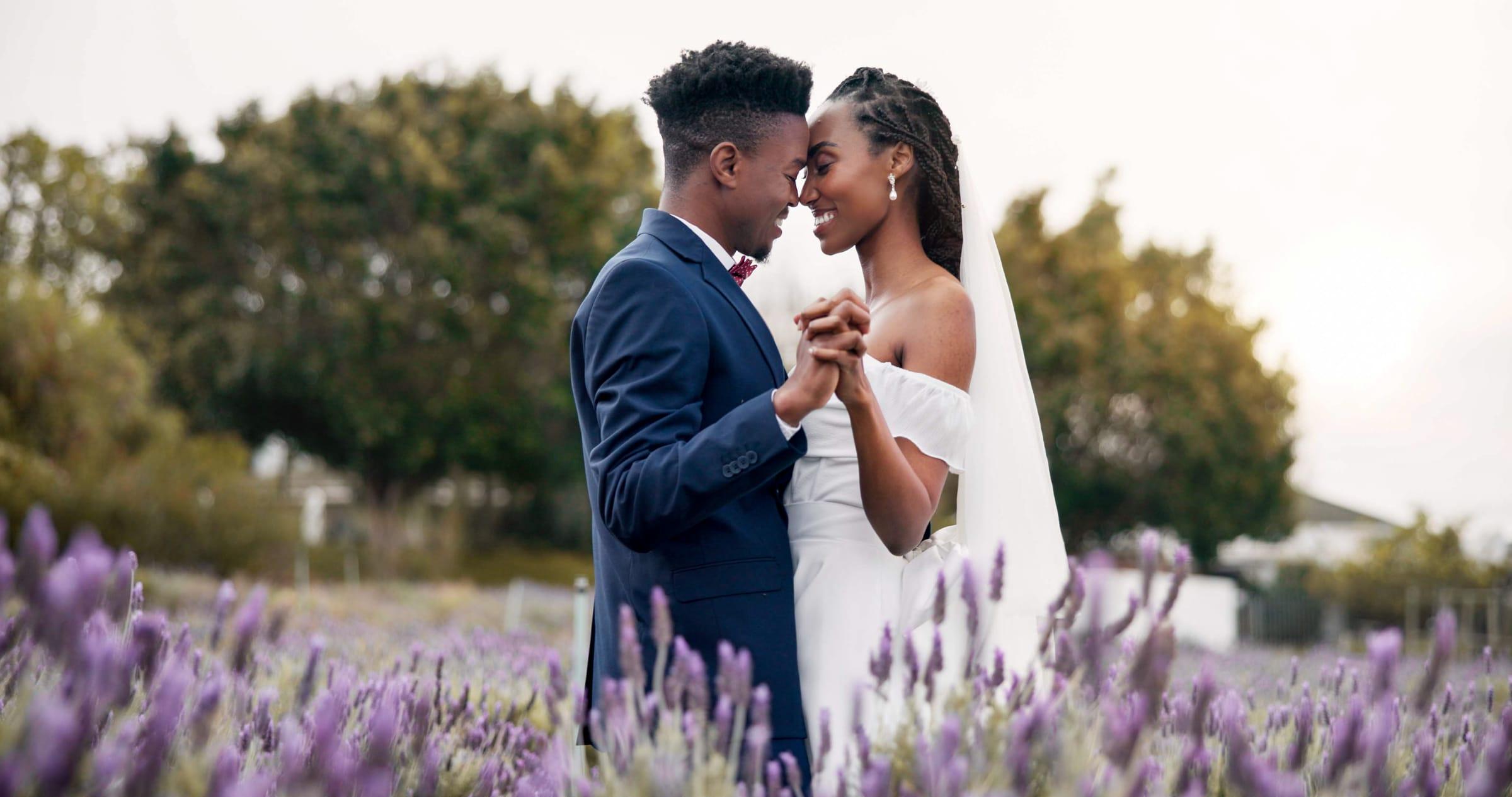 Bride and groom slow dance in a lavender field at golden hour, Ontario wedding